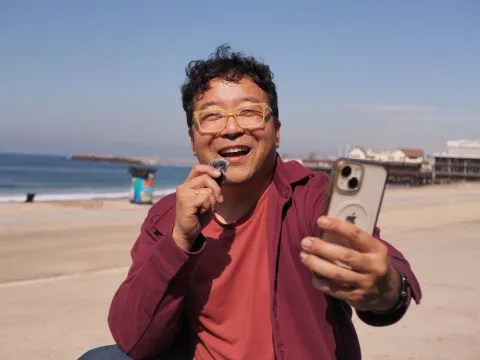 Ed filming at the beach